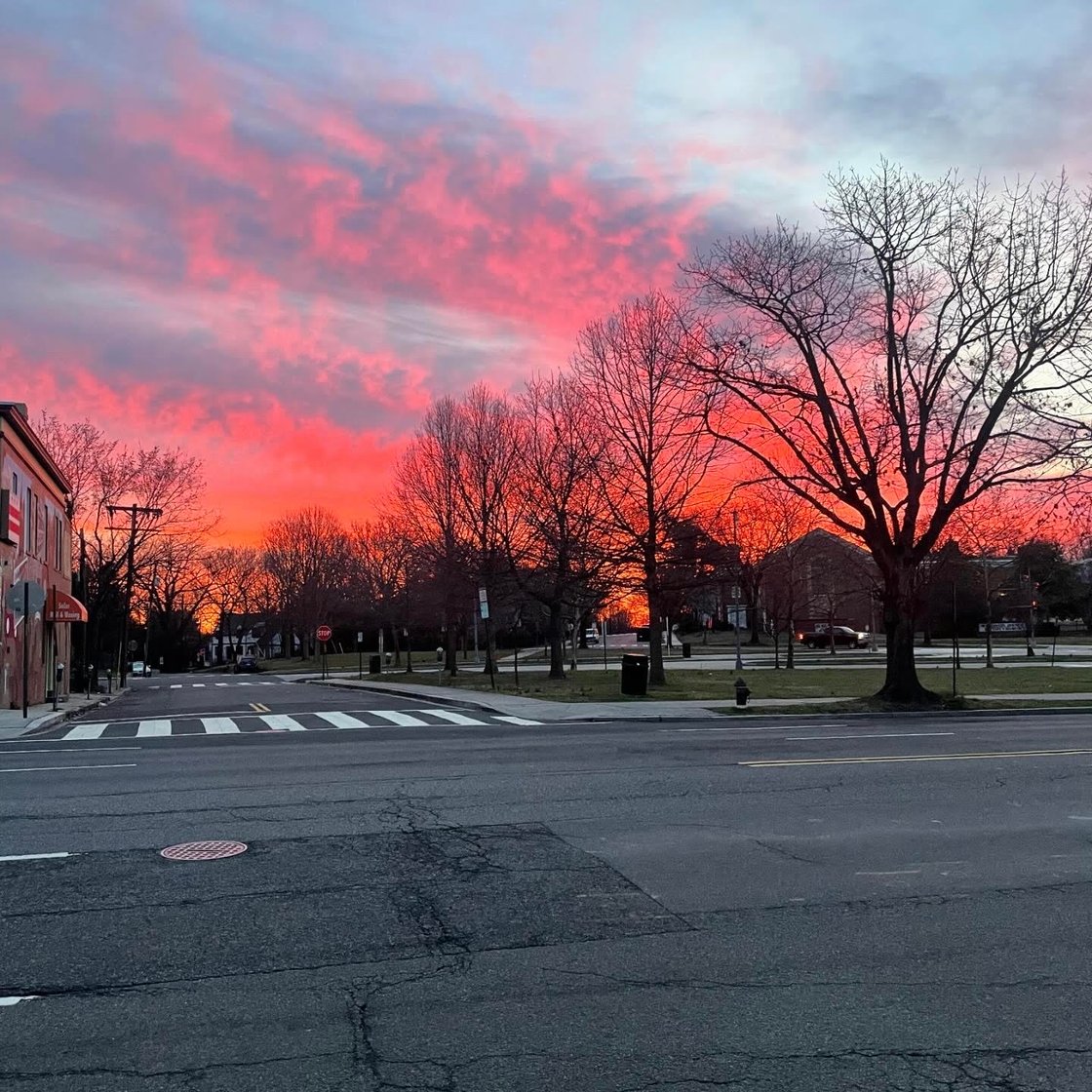 Tenleytown in front of pink and grey sky.